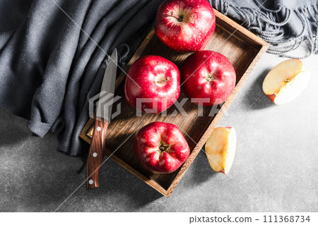 red apples on wooden background red apples on wooden background 111368734