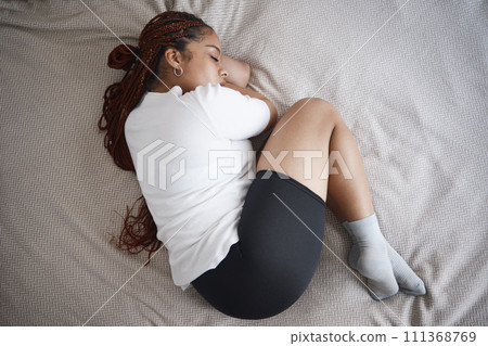 Woman with depression, mental health and anxiety or stress about life fail, crisis or bullying trauma. Insomnia, sad and headache girl with fear, depressed and sleeping female in bedroom 111368769