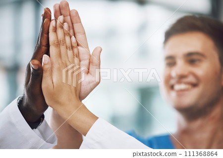Hands, high five and collaboration with a team of a doctor, nurse and health professional working in the hospital. Teamwork, motivation and support with a medical group at work in a clinic for care Hands, high five and collaboration with a team of a doctor, nurse and health professional working in the hospital. Teamwork, motivation and support with a medical group at work in a clinic for care 111368864