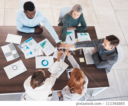 Team, hands together and meeting collaboration about analytics of sales revenue, growth and group development project. Top view, global and business people planning our vision, target and mission Team, hands together and meeting collaboration about analytics of sales revenue, growth and group development project. Top view, global and business people planning our vision, target and mission 111368865
