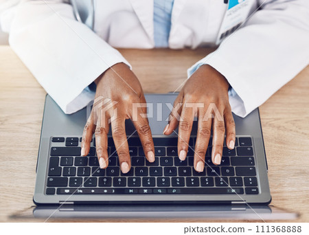 Hands, woman and doctor with laptop working at a desk in a hospital office. Medical expert with wireless technology to diagnose or research diseases in the field of health and medicine online or web 111368888