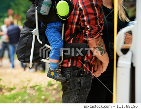 Man, child and woman in nature at music festival in woods, relax and family at carnival in outdoor. Father, kid and mother for bonding together on vacation and love in forest for social in community Man, child and woman in nature at music festival in woods, relax and family at carnival in outdoor. Father, kid and mother for bonding together on vacation and love in forest for social in community 111369150