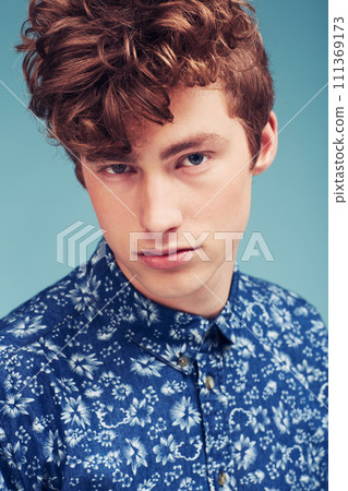 Fashion, serious and portrait of man on blue background in trendy shirt, stylish outfit and casual clothes. Aesthetic, attractive model and face of person with confidence, pride and style in studio Fashion, serious and portrait of man on blue background in trendy shirt, stylish outfit and casual clothes. Aesthetic, attractive model and face of person with confidence, pride and style in studio 111369173
