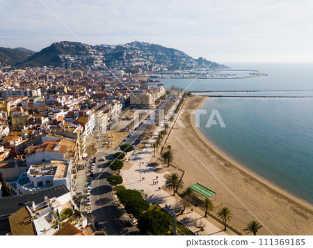Waterfront promenade in city Roses 111369185