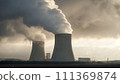 Smoke is coming from the turbine building of a nuclear power plant. 111369874