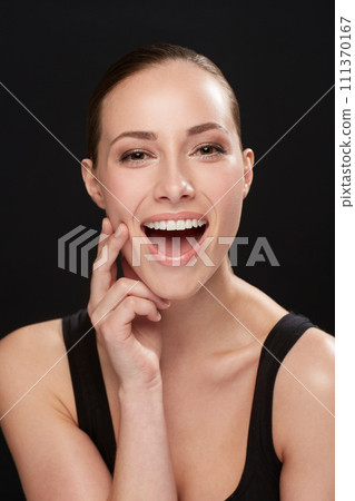 Studio, portrait and beauty of woman with laughing, cosmetic and facial treatment on black background. Model, happy or make up for spa cosmetology for glow results, skincare or collagen for soft skin Studio, portrait and beauty of woman with laughing, cosmetic and facial treatment on black background. Model, happy or make up for spa cosmetology for glow results, skincare or collagen for soft skin 111370167