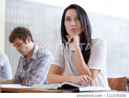 University, thinking and woman in lecture with books for development in learning, opportunity and future. Education, knowledge and growth for college student in classroom, studying for exam or test. 111370208