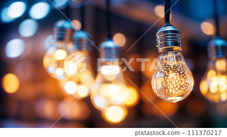 Closeup of hanging modern LED light bulbs with blurry bokeh background. Warm lighting, Closeup of hanging modern LED light bulbs with blurry bokeh background. Warm lighting, 111370217