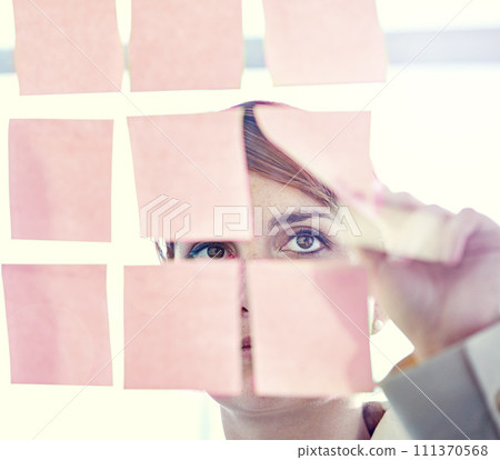 Businesswoman, sticky notes and glass wall for planning, thinking and vision for logistics and ideas. Employee, brainstorming and mockup for meeting, goals and teamwork for project management 111370568