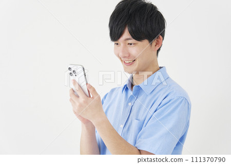 A man using a smartphone, white background A man using a smartphone, white background 111370790