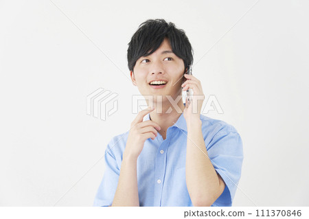 A man calling on a smartphone while imagining, white background 111370846