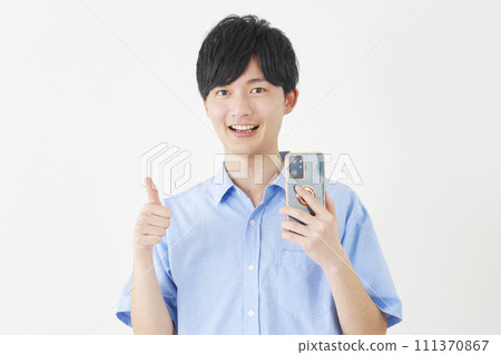 A man holding a smartphone and giving a good sign, white background 111370867