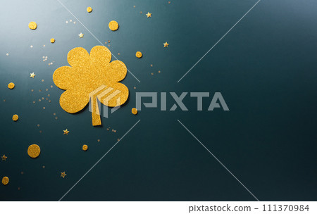 Happy St Patrick's Day decoration concept made from shamrocks ( clover leaf) on dark background. Happy St Patrick's Day decoration concept made from shamrocks ( clover leaf) on dark background. 111370984