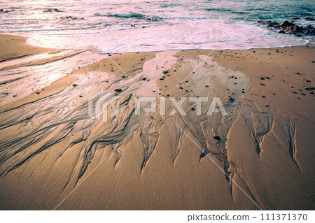 The texture of the sandy beach in the evening. Atlantic Ocean, Portugal 111371370