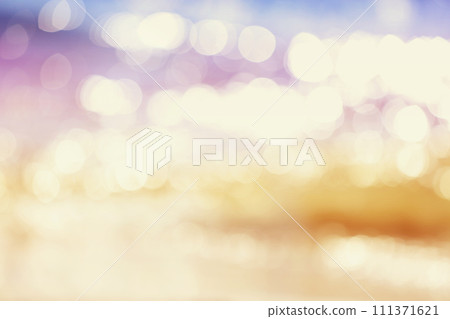 Abstract nature background blurred bokeh sun flare on sea water in sunset light 111371621