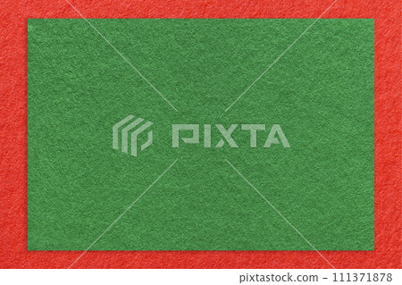 Texture of craft green color paper background with red border, macro. Vintage dense kraft olive cardboard Texture of craft green color paper background with red border, macro. Vintage dense kraft olive cardboard 111371878