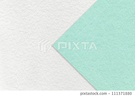 Texture of white paper background, half two colors with light mint arrow, macro. Craft cyan cardboard. Texture of white paper background, half two colors with light mint arrow, macro. Craft cyan cardboard. 111371880
