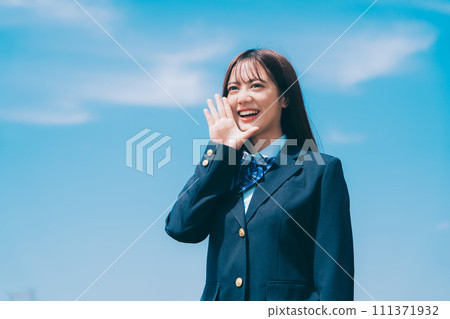 High school girls cheering against the blue sky 111371932