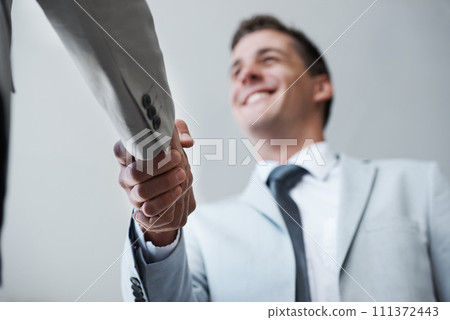 Low angle, businessman and shaking hands with partner, colleague and smile for deal or promotion. Man, consult and hand for contract agreement, interview and advice for agency and office partnership Low angle, businessman and shaking hands with partner, colleague and smile for deal or promotion. Man, consult and hand for contract agreement, interview and advice for agency and office partnership 111372443