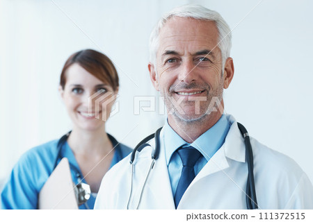 Smile, portrait and doctor with nurse in hospital with clipboard for medical research in collaboration. Happy, checklist and senior male surgeon with healthcare worker in clinic for teamwork. 111372515