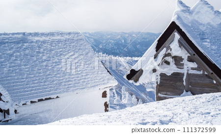 Mt. Moriyoshi in clear winter weather, evacuation hut and Moriyoshi Shrine 111372599