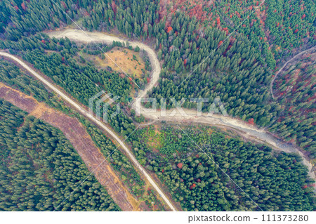Aerial view of the mountains in autumn. The road along the winding river. Beautiful nature landscape. Prut River, Carpathian mountains. Ukraine 111373280