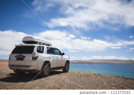 Tibet,China - April 07,2023 ,Driving Toyota off road car on the high altitude mountains Tibet,China - April 07,2023 ,Driving Toyota off road car on the high altitude mountains 111373591