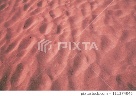 Abstract sandy background. The texture of the beach sand Abstract sandy background. The texture of the beach sand 111374045