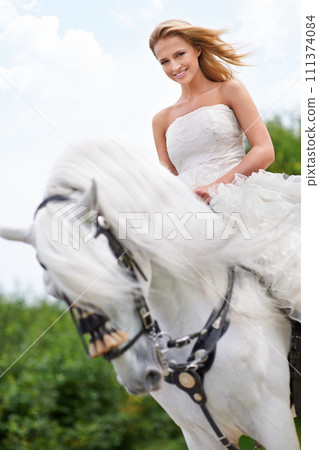 Wedding, woman and portrait with horse outdoor in nature for celebration, marriage or confidence in countryside. Bride, person and stallion in field with smile, dress and animal at ceremony in nature Wedding, woman and portrait with horse outdoor in nature for celebration, marriage or confidence in countryside. Bride, person and stallion in field with smile, dress and animal at ceremony in nature 111374084