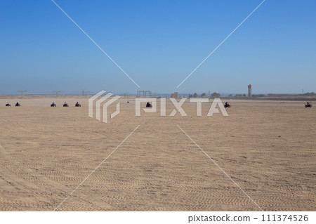 Excursion on ATV in desert 111374526