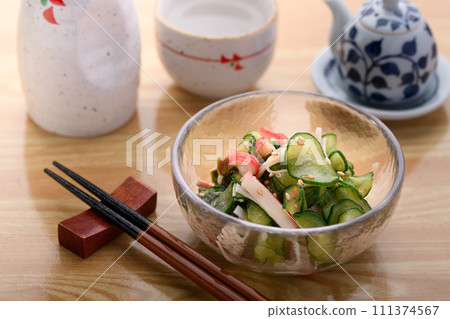 Pickled cucumber and hot sake 111374567