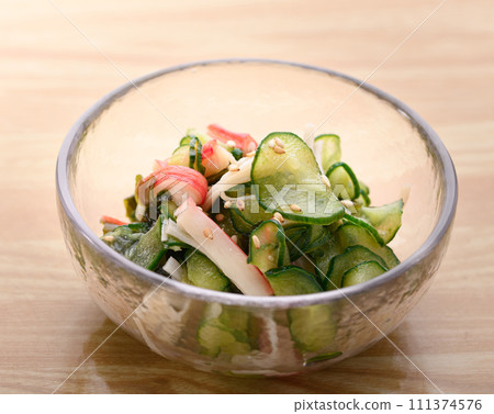 Pickled cucumber served in a small bowl Pickled cucumber served in a small bowl 111374576
