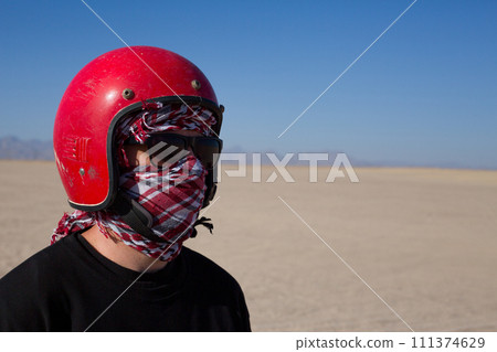Portrait of man in red helmet and keffiyeh 111374629