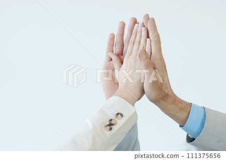 Hands, high five and people with celebration of success, achievement and support for teamwork. Business, collaboration and team building gesture for cooperation, solidarity and pride for winning Hands, high five and people with celebration of success, achievement and support for teamwork. Business, collaboration and team building gesture for cooperation, solidarity and pride for winning 111375656