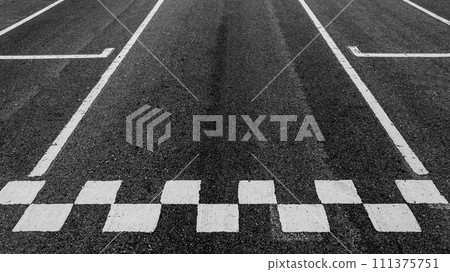 Aerial view abstract asphalt black Start and Finish grid line for race car in circuit texture background, Automobile and automotive background. Aerial view abstract asphalt black Start and Finish grid line for race car in circuit texture background, Automobile and automotive background. 111375751