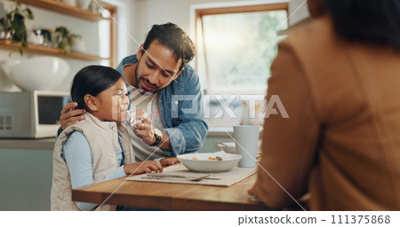 Parents, children and a girl eating spaghetti with her family in the dining room of their home together for supper. Food, kids and father around a table for a meal, bonding over dinner in a house Parents, children and a girl eating spaghetti with her family in the dining room of their home together for supper. Food, kids and father around a table for a meal, bonding over dinner in a house 111375868
