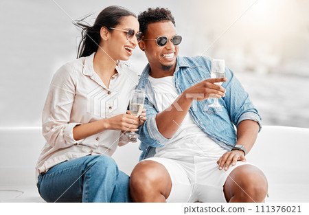 Couple date, champagne celebration and comic conversation at birthday dinner, happy with alcohol and smile for love marriage in the city. Man and woman on terrace with glass of wine in summer 111376021