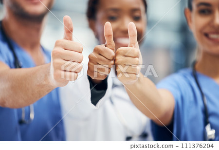 Doctors, nurses or thumbs up hands in success, teamwork collaboration or trust with medical winner goal. Zoom on thank you, motivation and vote sign on man and support women in healthcare hospital Doctors, nurses or thumbs up hands in success, teamwork collaboration or trust with medical winner goal. Zoom on thank you, motivation and vote sign on man and support women in healthcare hospital 111376204