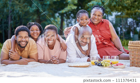 Love, picnic and family time with black people smile and relax at a park or forest, bonding and having fun. Portrait cheerful girl enjoy weekend with grandparents and parents, playing and embracing 111376431