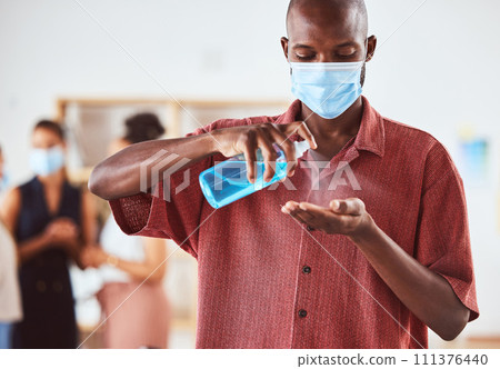 Covid, hand sanitizer and business man with face mask at business meeting for healthcare safety, risk management and compliance. Covid 19, corona virus and policy black man with spray bottle cleaning Covid, hand sanitizer and business man with face mask at business meeting for healthcare safety, risk management and compliance. Covid 19, corona virus and policy black man with spray bottle cleaning 111376440