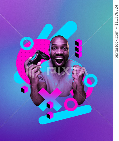 Happy smiling African man with game controller showing winning emotions, playing online video games against gradient neon background. Streaming. Online gaming culture Happy smiling African man with game controller showing winning emotions, playing online video games against gradient neon background. Streaming. Online gaming culture 111376524