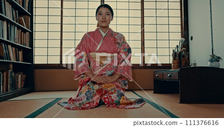 Japanese woman, face and kimono for ceremony in Chashitsu room and sitting on the floor. Traditional, fashion or girl with pride, respect and honor for culture, heritage and waiting for matcha or tea Japanese woman, face and kimono for ceremony in Chashitsu room and sitting on the floor. Traditional, fashion or girl with pride, respect and honor for culture, heritage and waiting for matcha or tea 111376616