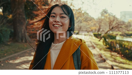 Japanese, portrait and woman with smile in park for travel on vacation, adventure and explore path with trees. Gen z, student and happy walk on holiday in nature, forest and trail in Kyoto woods Japanese, portrait and woman with smile in park for travel on vacation, adventure and explore path with trees. Gen z, student and happy walk on holiday in nature, forest and trail in Kyoto woods 111377113
