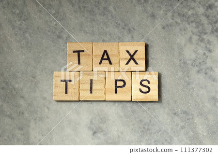 The row of wooden cubes with 'Tax tips' text The row of wooden cubes with 'Tax tips' text 111377302