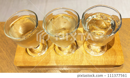 Compare sake in glass choko cups Compare sake in glass choko cups 111377561