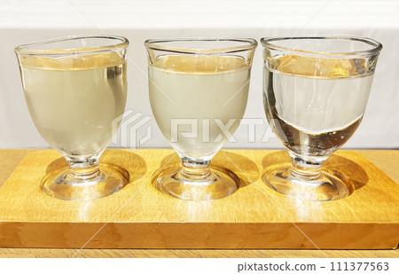 Compare sake in glass choko cups Compare sake in glass choko cups 111377563
