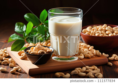 Alternative milk from cashews in a glass on the table 111377834