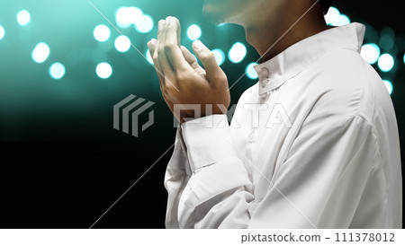 Muslim man raised her hands and prayed to Allah 111378012