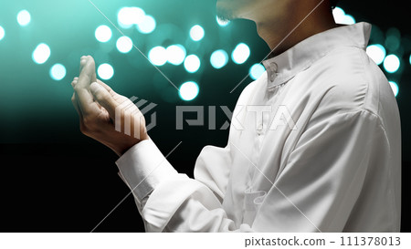 Muslim man raised her hands and prayed to Allah Muslim man raised her hands and prayed to Allah 111378013