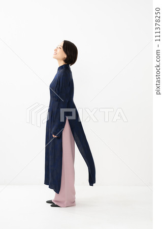 Woman wearing Ao Dai, profile 111378250